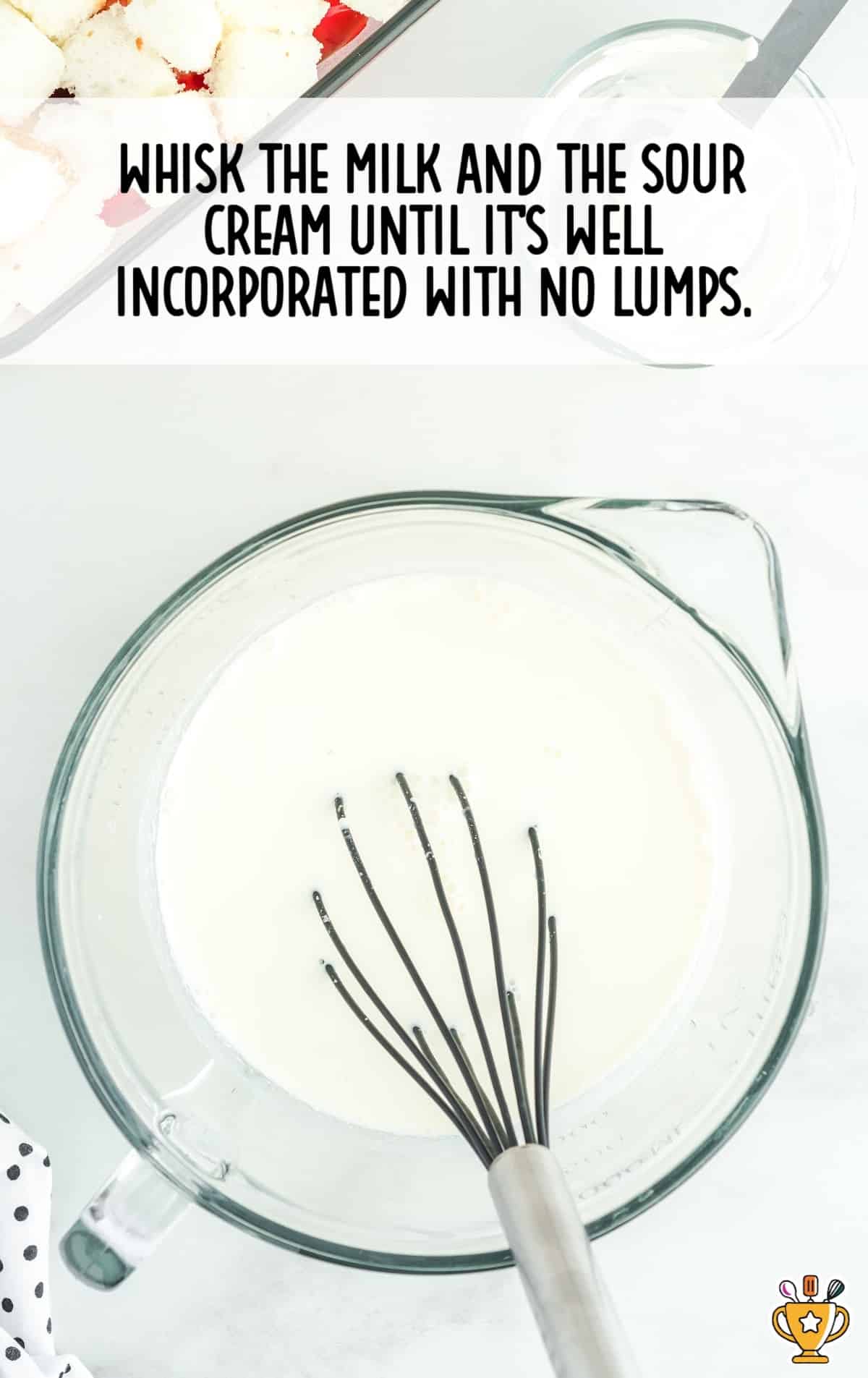 Whisking the mixture together in a mixing bowl.
