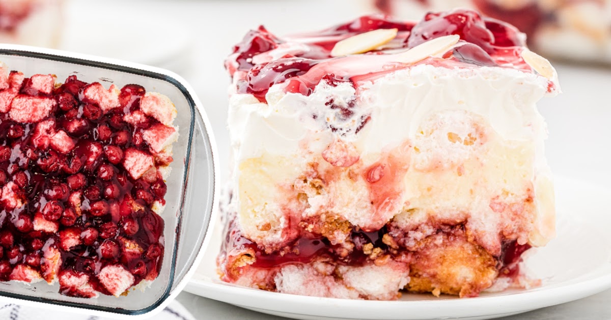 A slice of cake on a plate beside the cherries spread in a baking sheet.