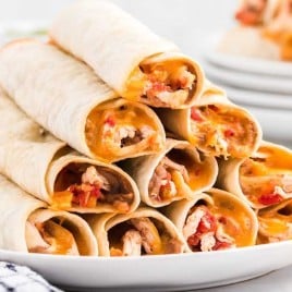 A plate of food, with Taquitos