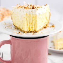 A cup of coffee, with Cream and Pie
