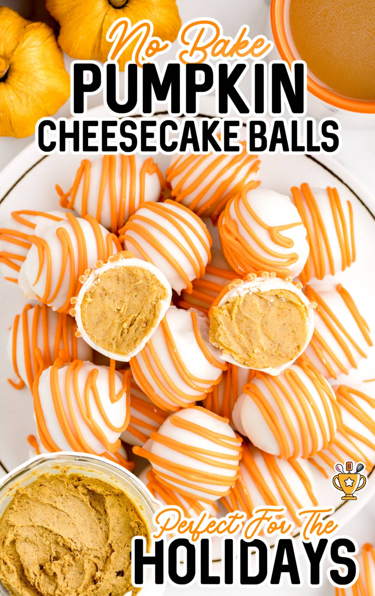 A white plate of No Bake Pumpkin Cheesecake Balls and one is split in half.
