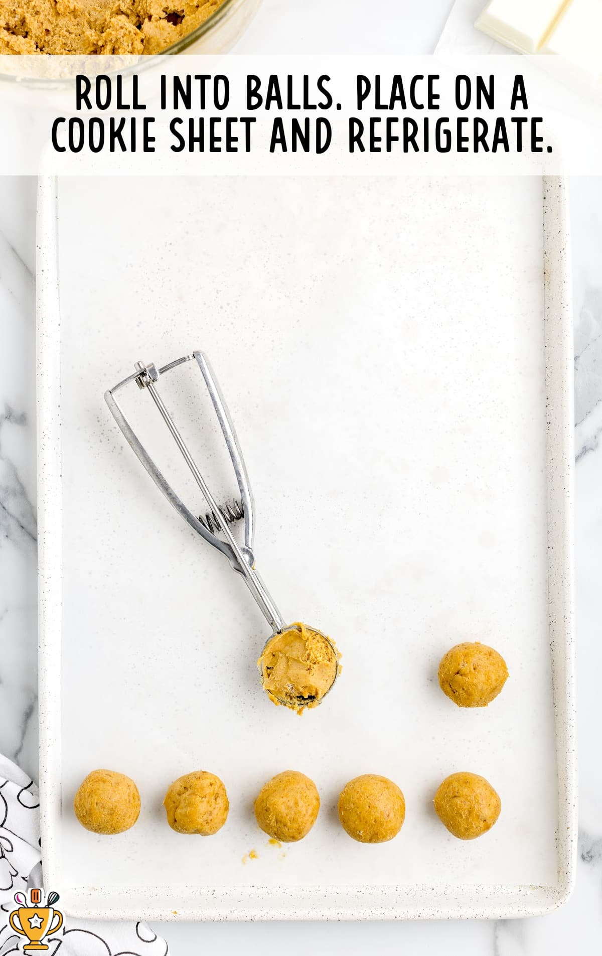 The balls are rolled out on a baking sheet.