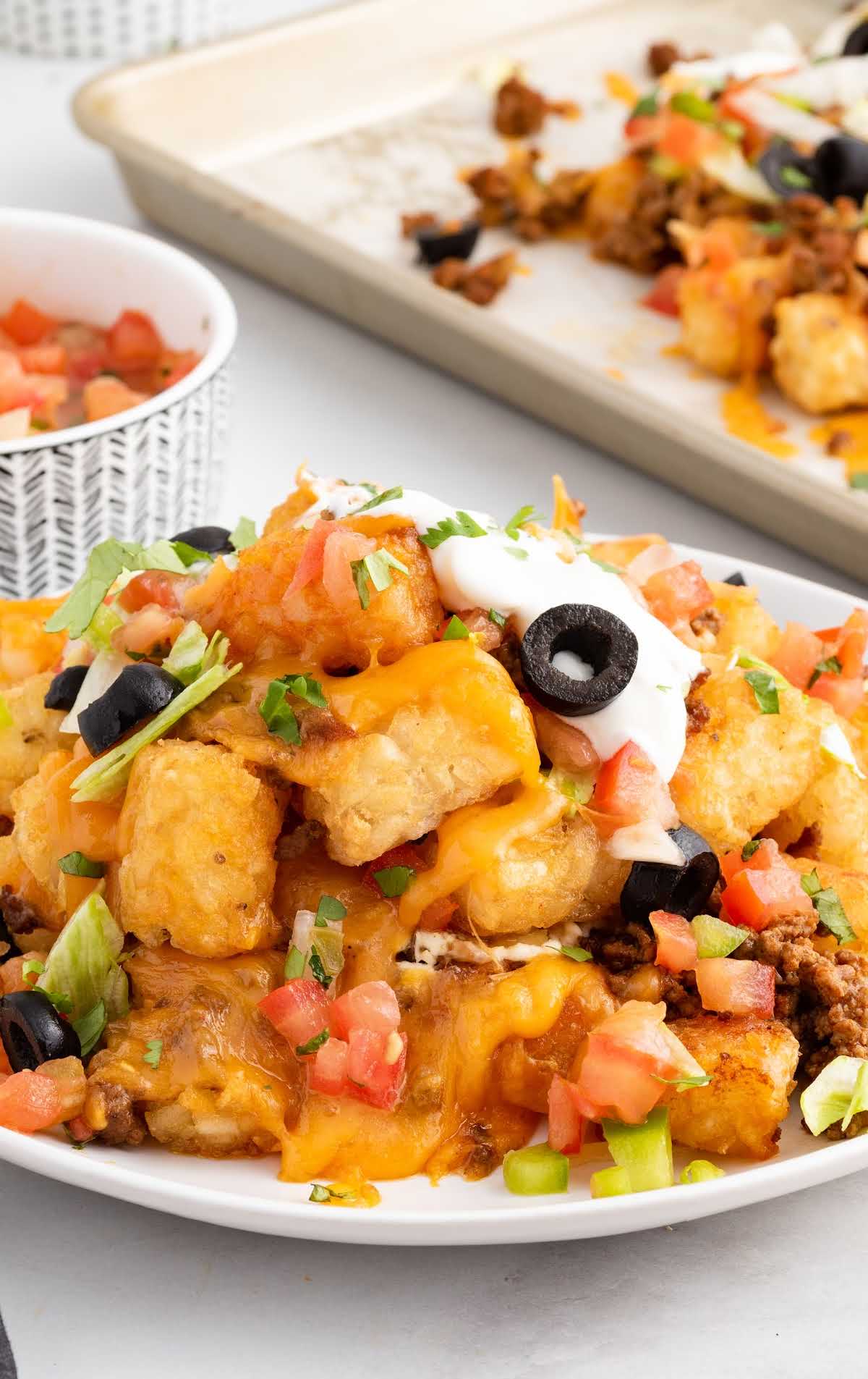A bunch of food on a plate, with Tater Tot Nachos