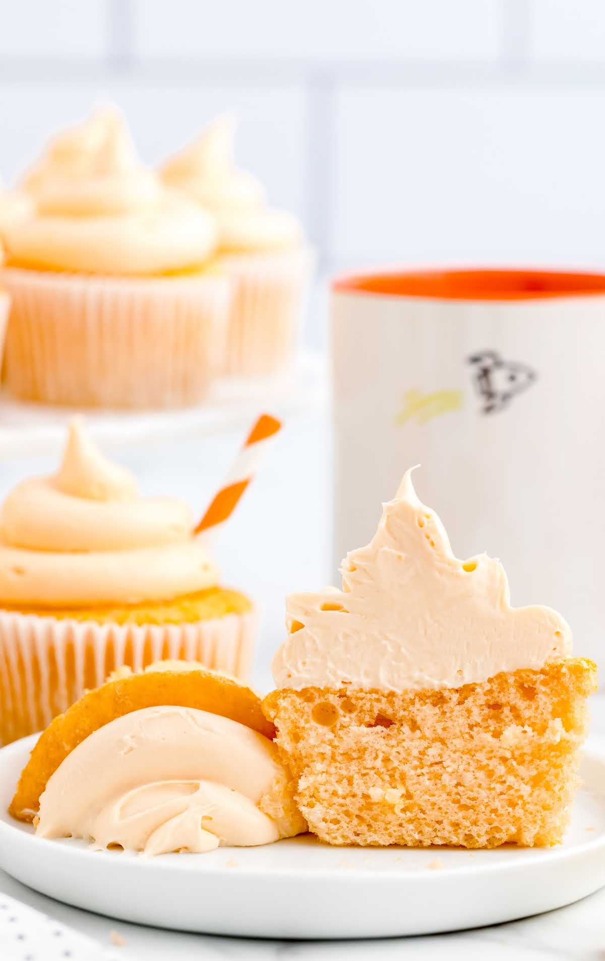 A close up of a slice of cake on a plate, with Cupcake and Orange