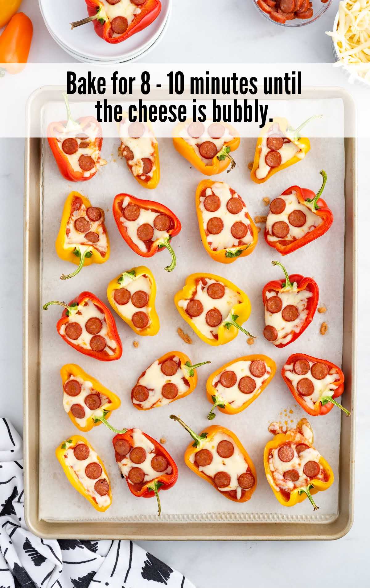 A tray of food on a plate, with Pizza bites