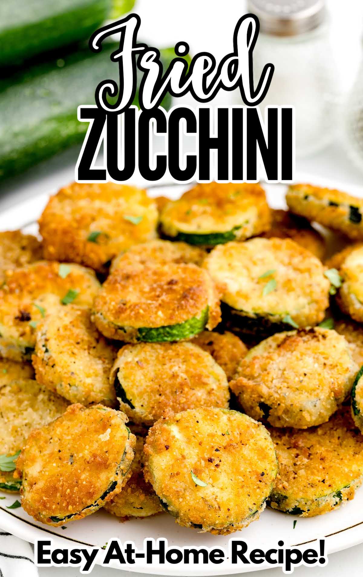 A plate of food, with Fried zucchini and side