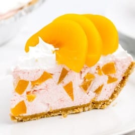 A slice of cake on a plate, with Peach and Pie