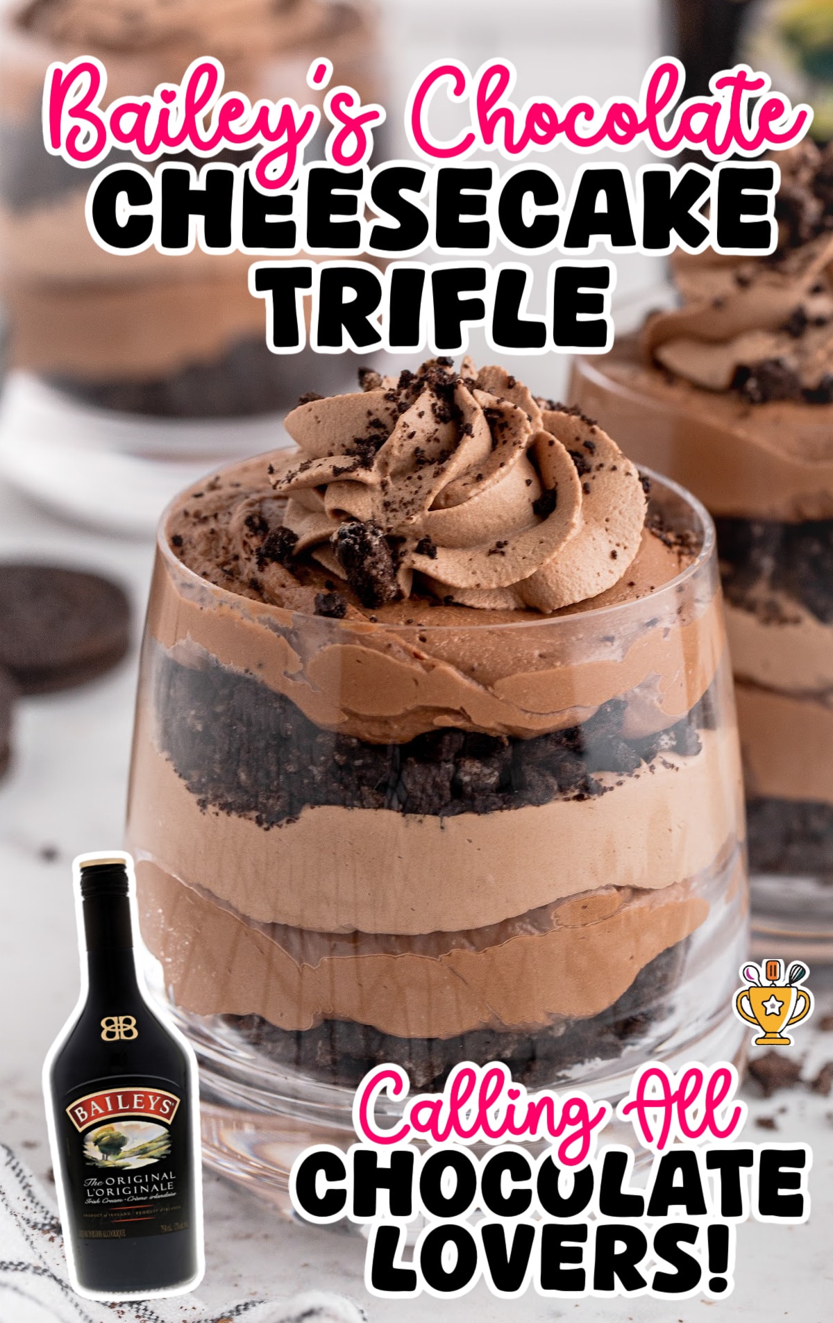 Close-up of a glass filled with Bailey’s chocolate cheesecake trifle, featuring layers of creamy chocolate cheesecake mousse, crushed chocolate cookies, and topped with a swirl of chocolate cream and cookie crumbs. A bottle of Baileys Irish Cream is pictured in the corner, with text overlay reading “Bailey’s Chocolate Cheesecake Trifle – Calling All Chocolate Lovers!”