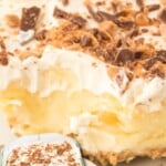 Vertical image of a creamy butter pecan crunch bar topped with crushed Heath bars, with text overlay promoting an easy no-bake dessert.