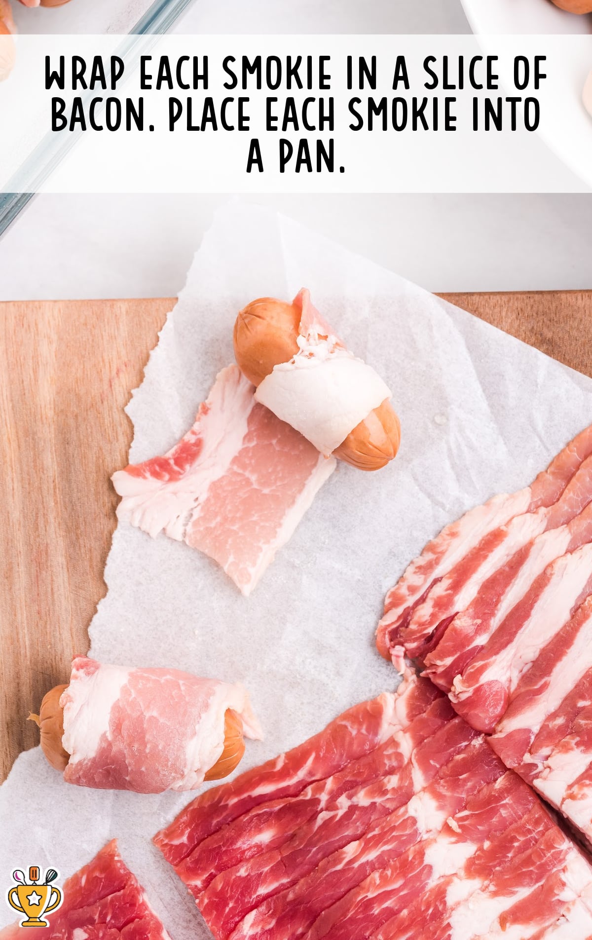 smokies on a cutting board being wrapped in bacon