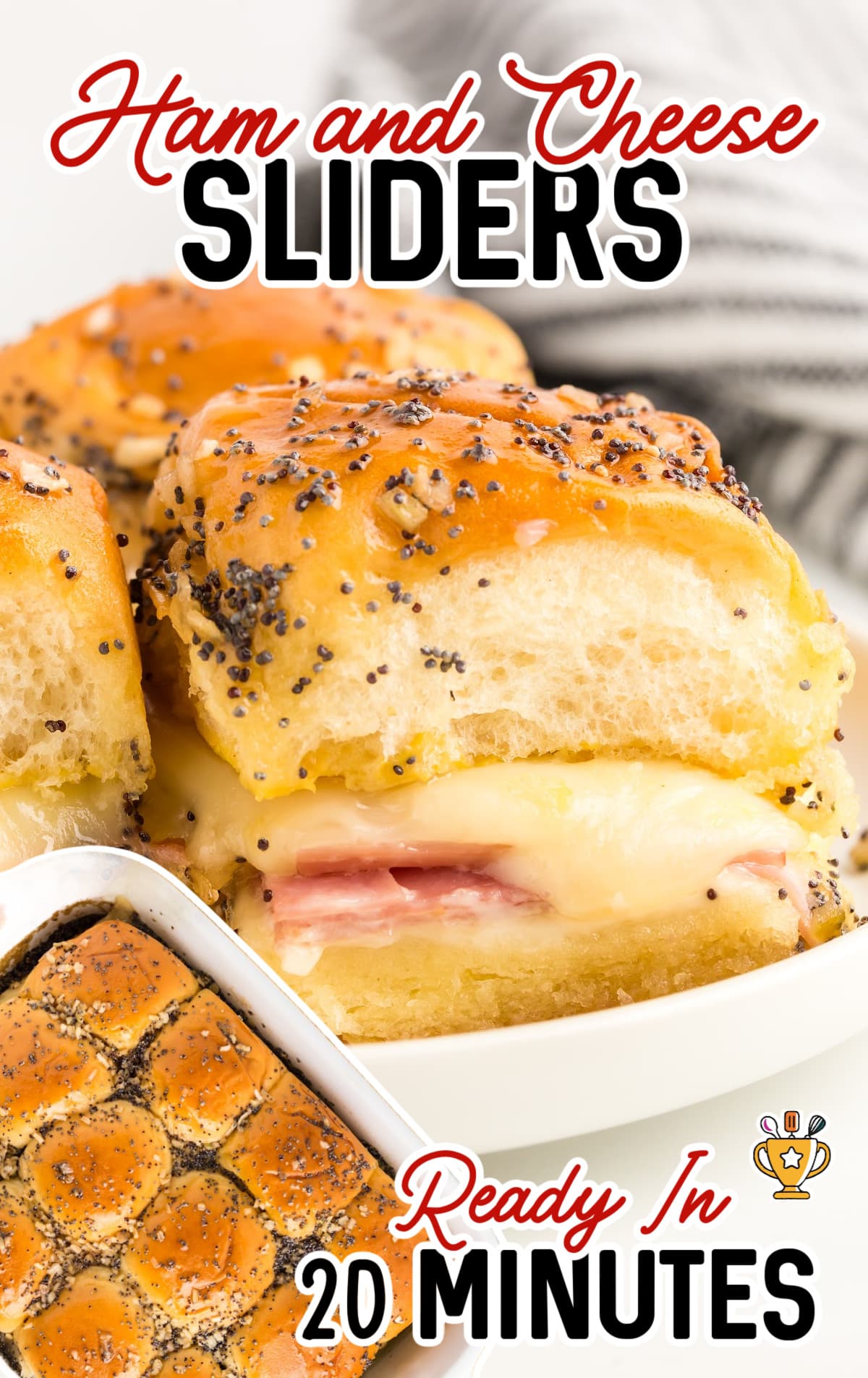 Ham and cheese sliders on a plate and a pan of sliders.