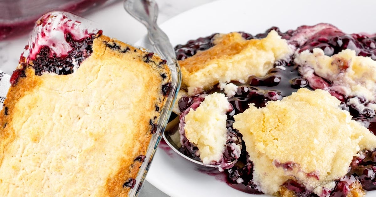 blueberry cream cheese dump cake on a plate with spoon