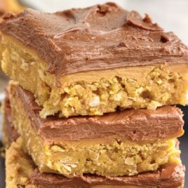 lunch lady peanut butter bars stacked together on a serving plate ready to eat