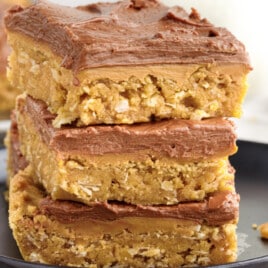 lunch lady peanut butter bars stacked together on a serving plate ready to eat