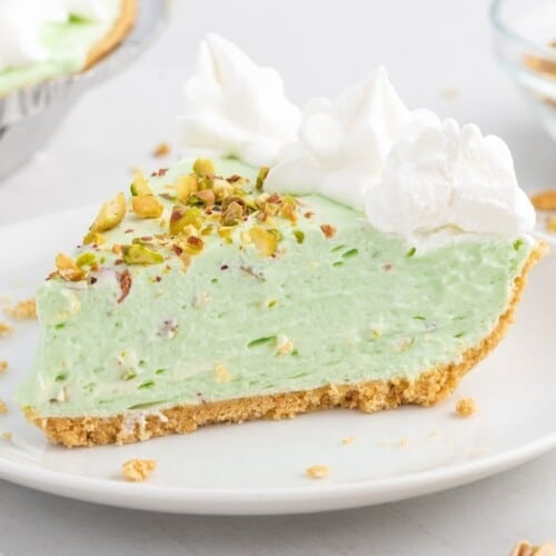 slice of pistachio pie on a plate ready to be eaten