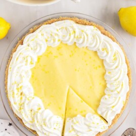 easy to make lemon cream cheese pie with a slice taken out to be served