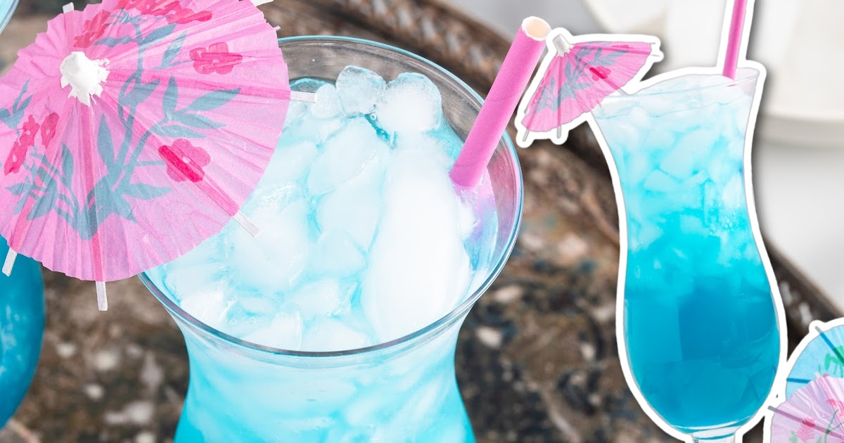  Blue Ocean Drink in a tall glass with an umbrella and straw