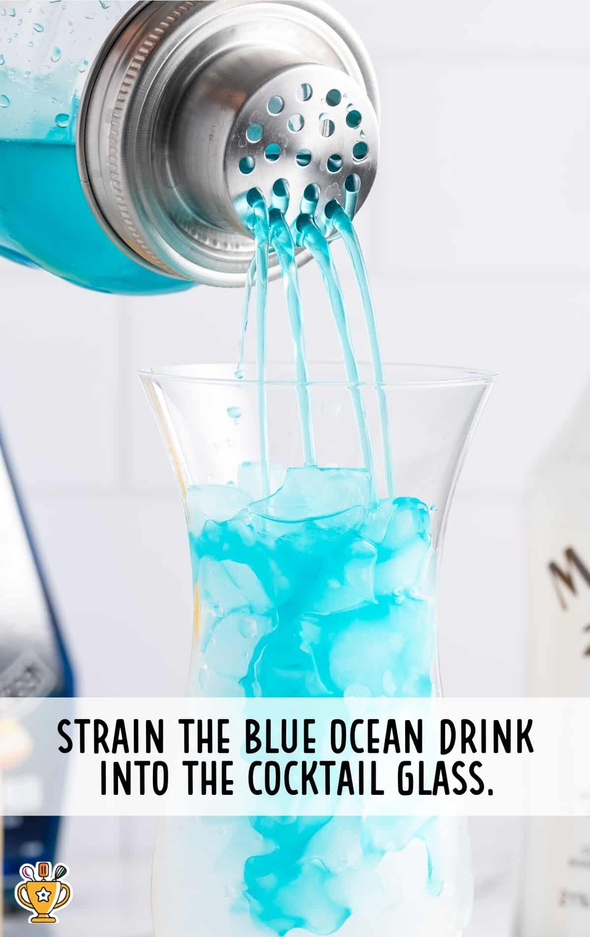 blue ocean drink strained into a cock tall glass