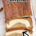 Banana Bread with slices cut on a wooden cutting board