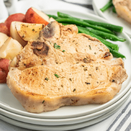 pork chops served with diced red potatoes and green beans