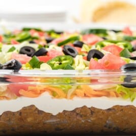 layered taco salad in a casserole dish ready to serve