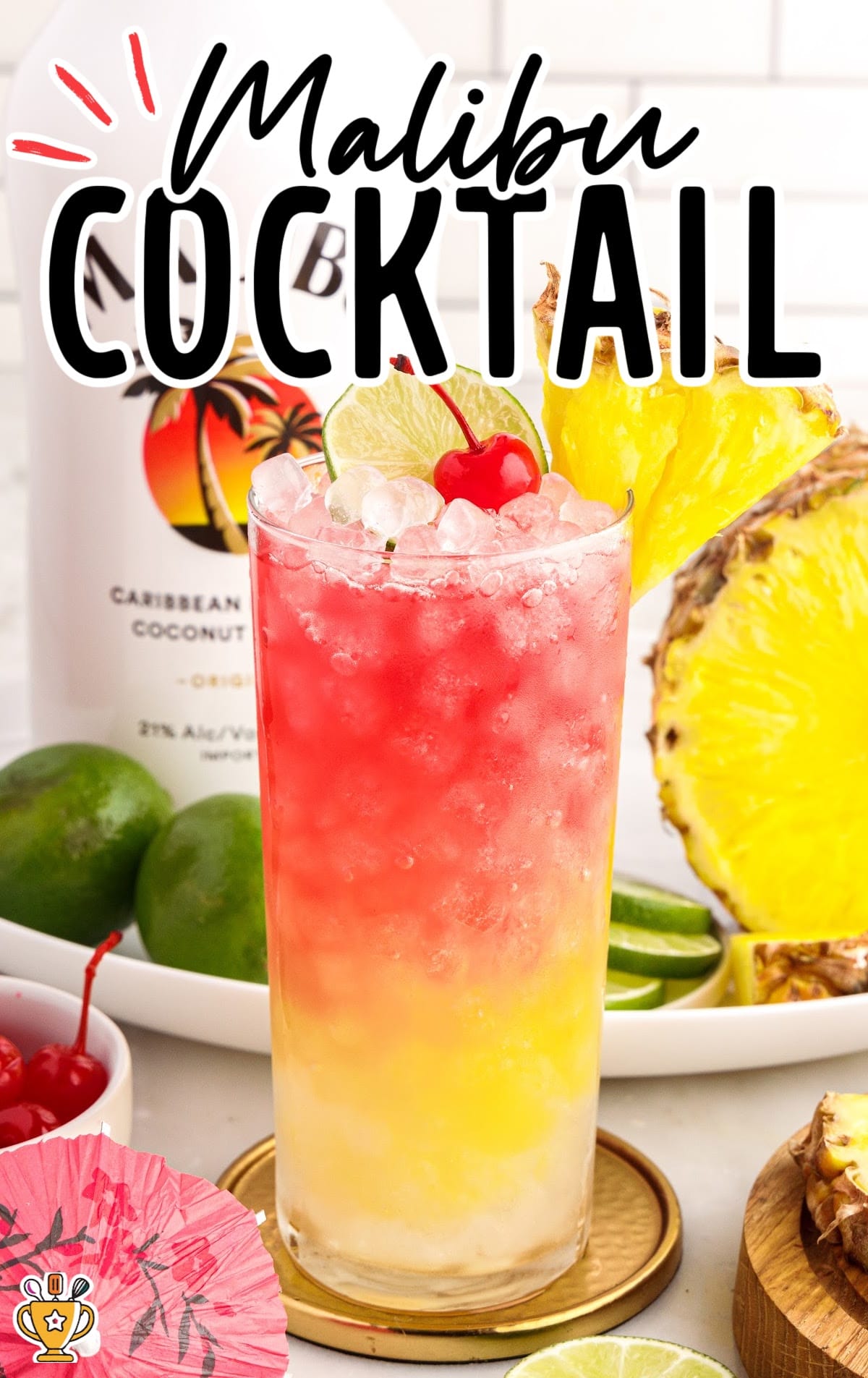  Malibu Cocktail garnished with a cherry, sliced pineapple, and a slice of lime