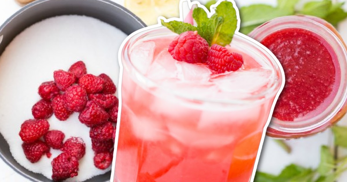 Raspberry Lemonade served in a glass and topped with raspberries and mint