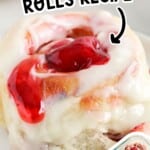 Strawberry cinnamon roll topped with cream cheese frosting and strawberry filling