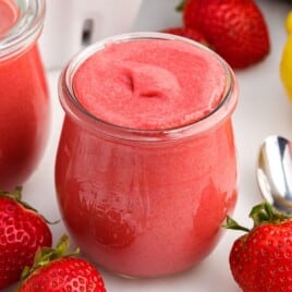 a close up shot of Strawberry Curd in a glass cup