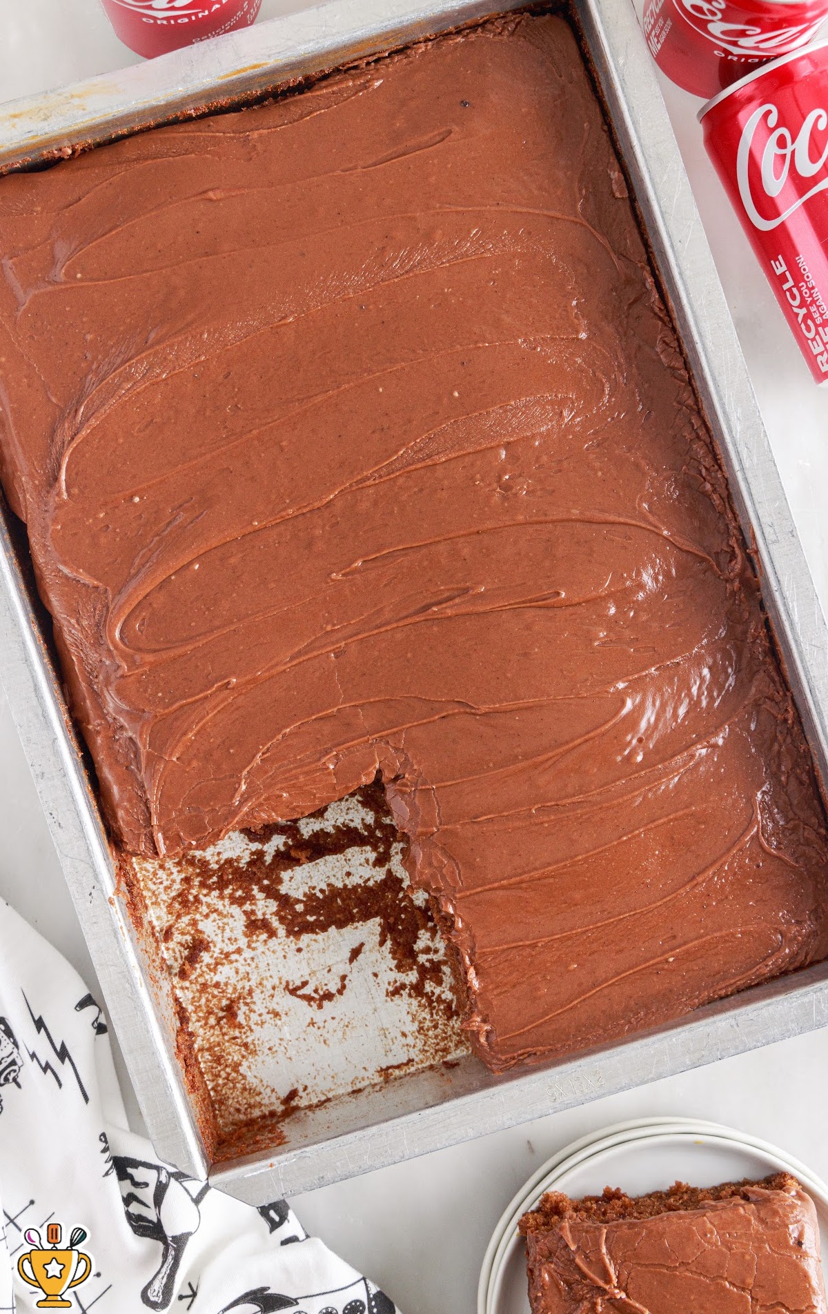 close up shot of chocolate cake recipe in a baking dish with a pice of cake missing