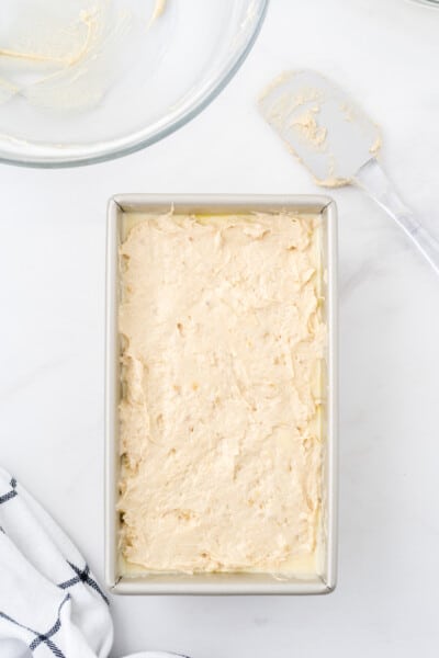 cream cheese banana bread batter in a loaf pan
