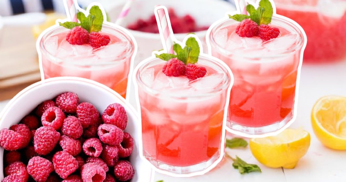 glasses of Raspberry Lemonade topped with raspberries and mint