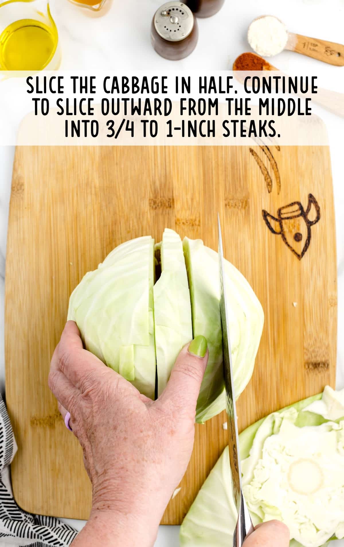 cabbage cut in half on a wooden board