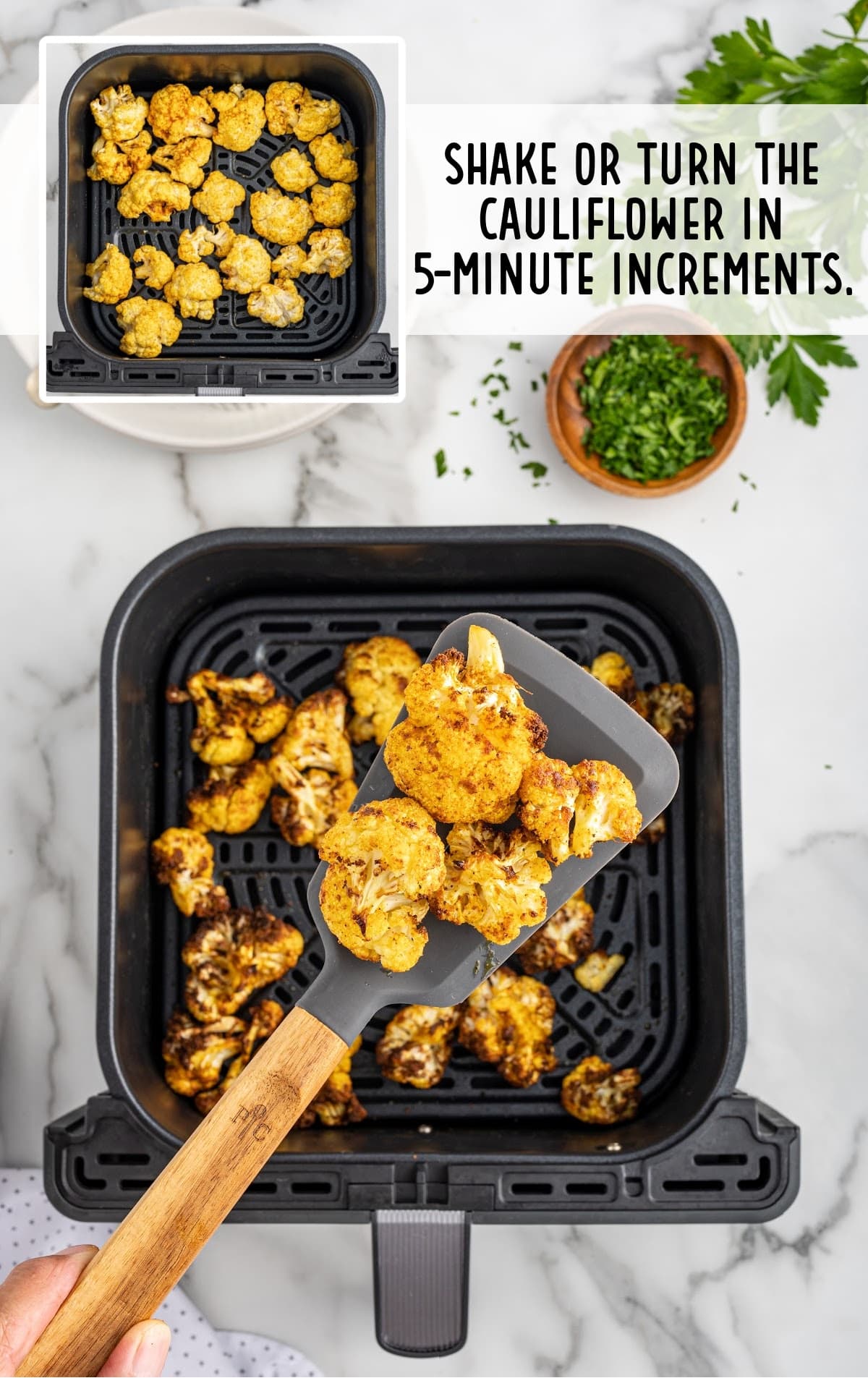 cauliflower being cooked in a air fryer