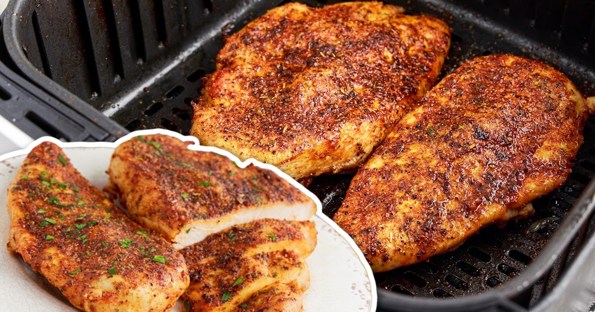 overhead shot of a couple of pieces of Air Fryer Chicken Breasts in a air fryer
