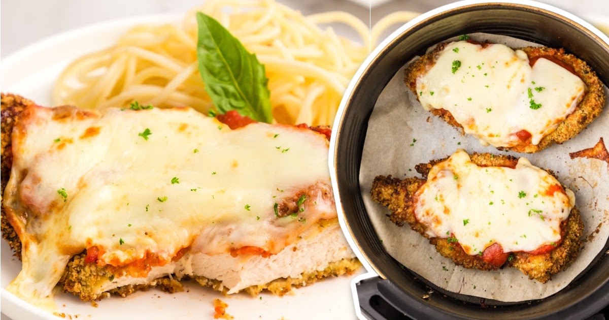 a close up shot of a couple of pieces of Air Fryer Chicken Breasts in a air fryer