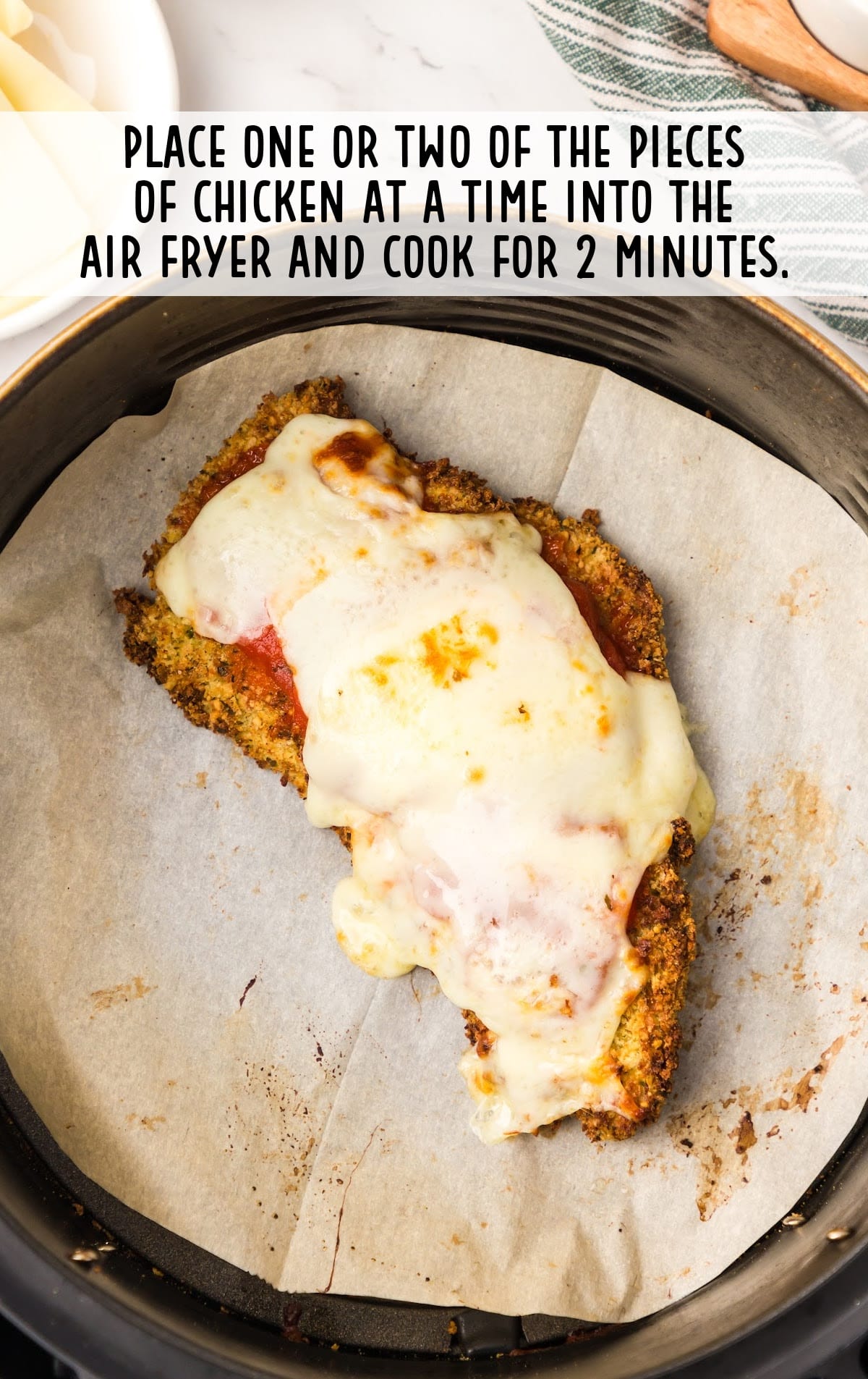 pieces of chicken placed in the air fryer