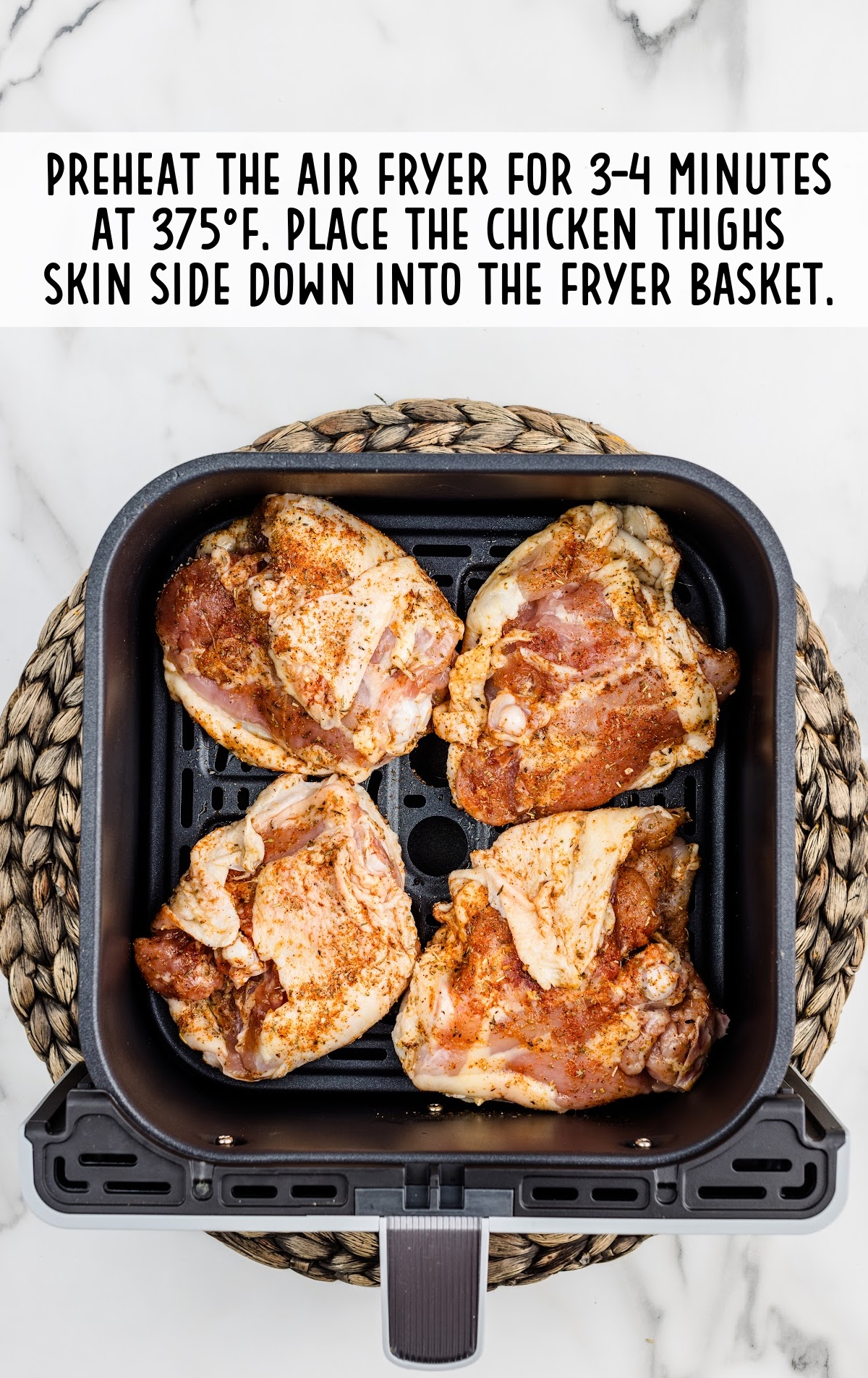 Chicken Thighs placed in an air fryer