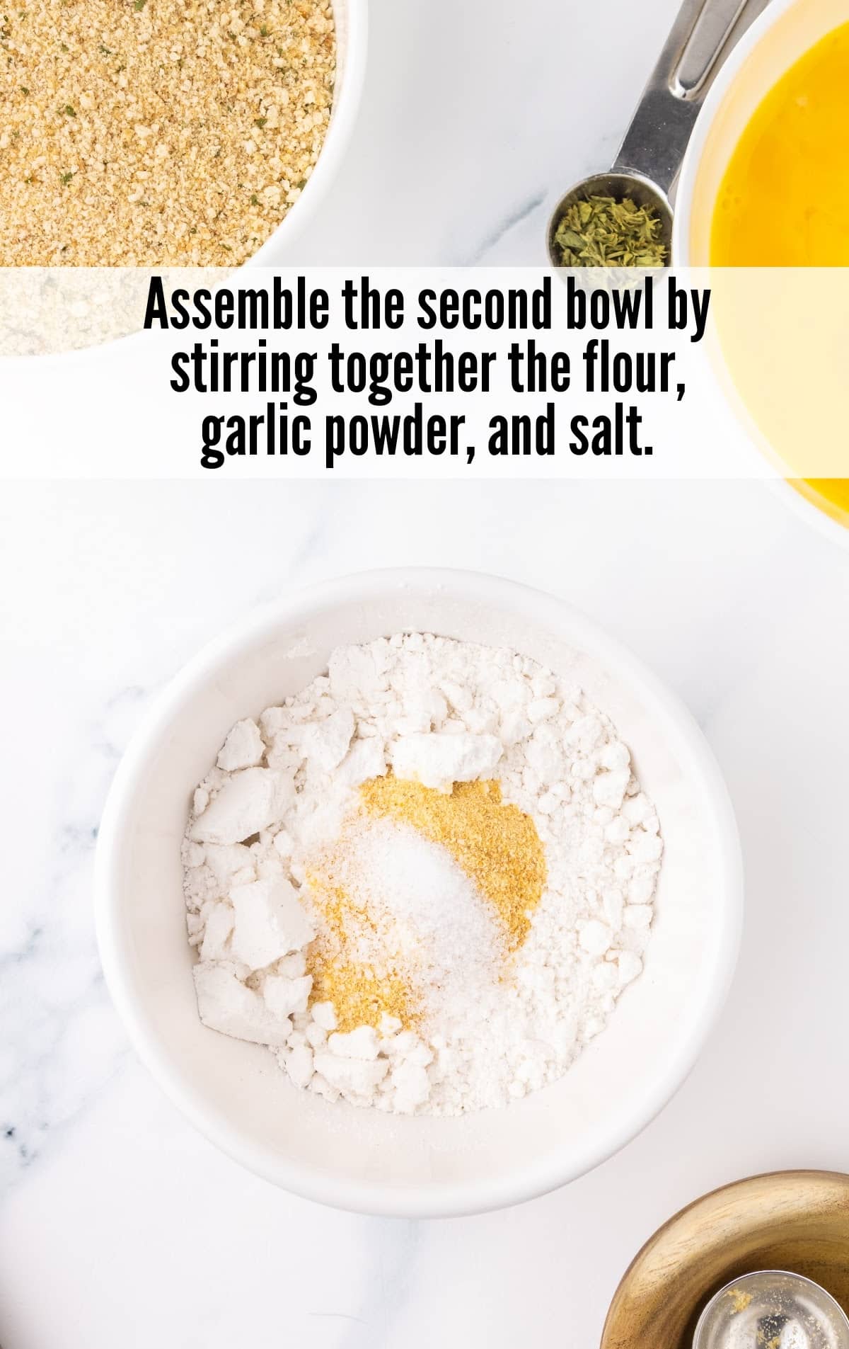 flour, garlic powder, and salt combined in the second bowl