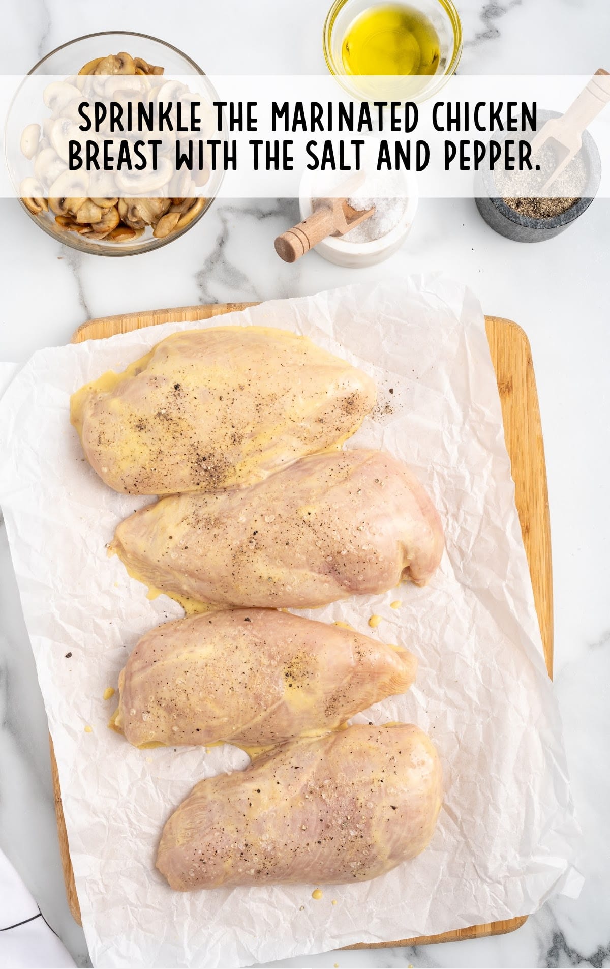 marinade chicken topped with salt and pepper