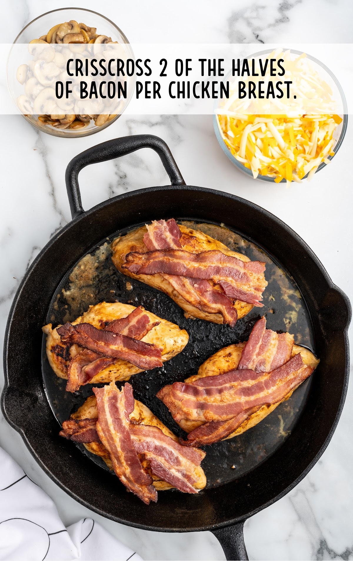 bacon placed on top of the skillet in a skillet