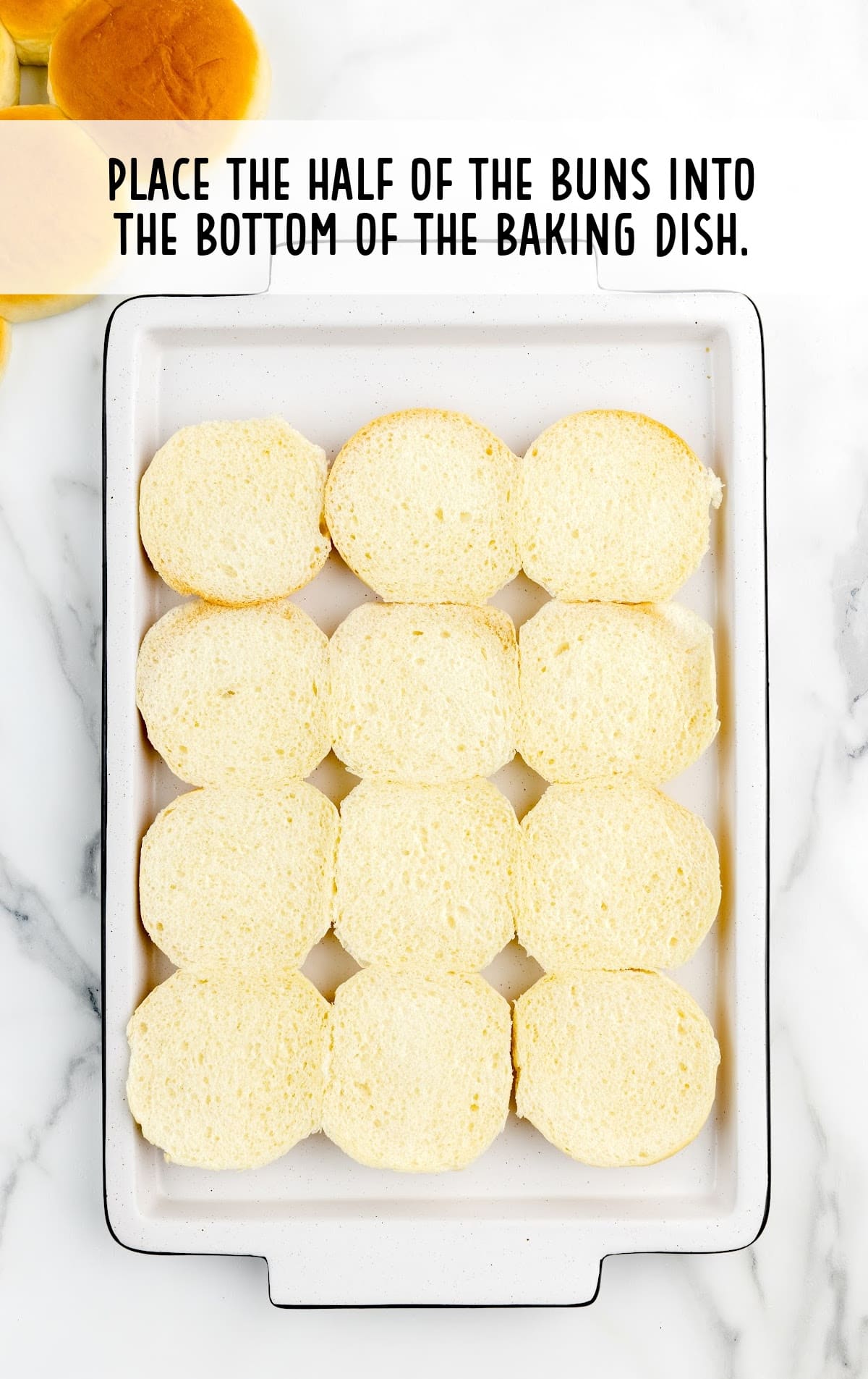 bottom of slider buns placed in the baking dish