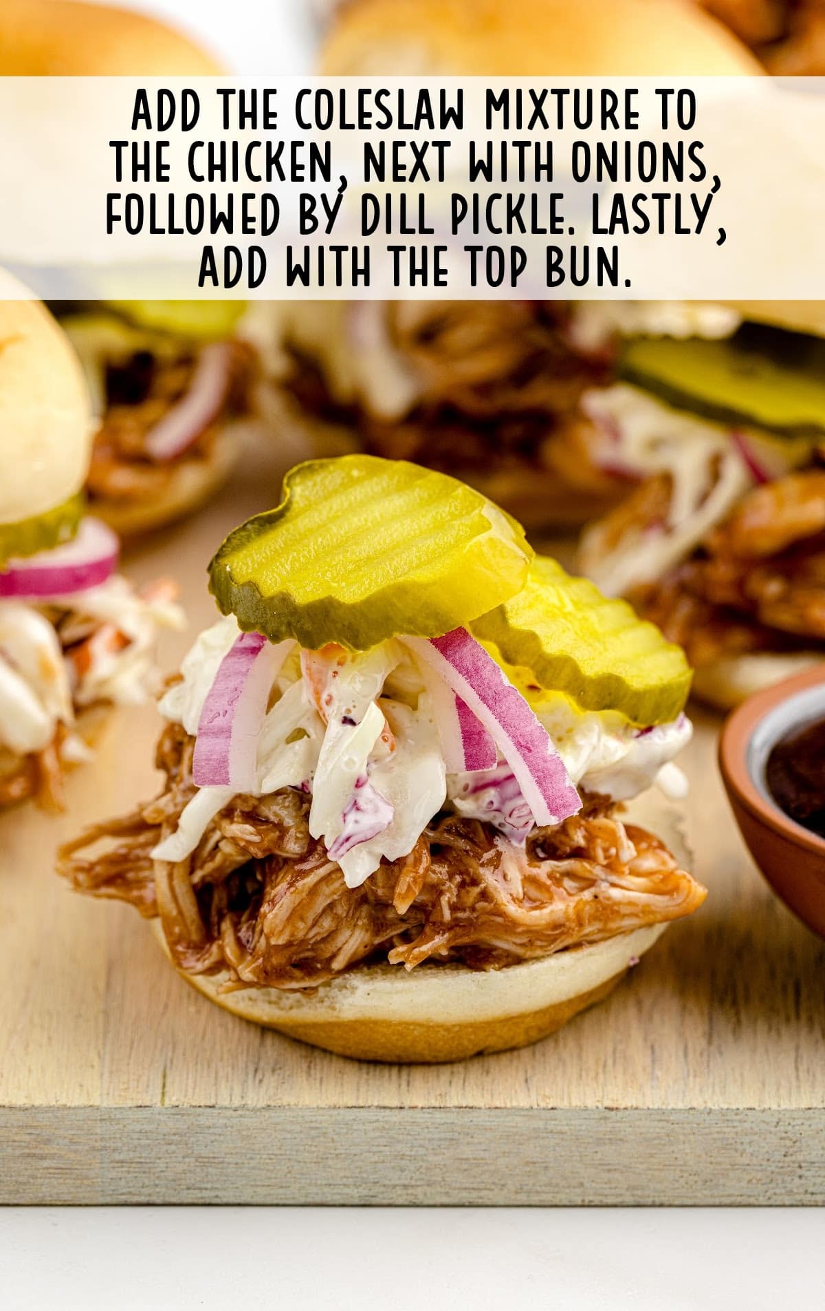 close up shot of Buffalo Chicken Sliders piled on a plate