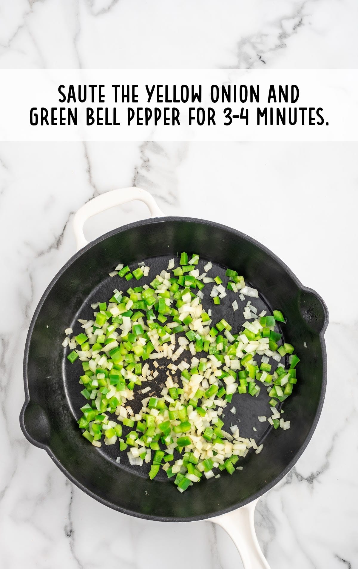 diced yellow onion and diced green bell pepper added to the hot skillet
