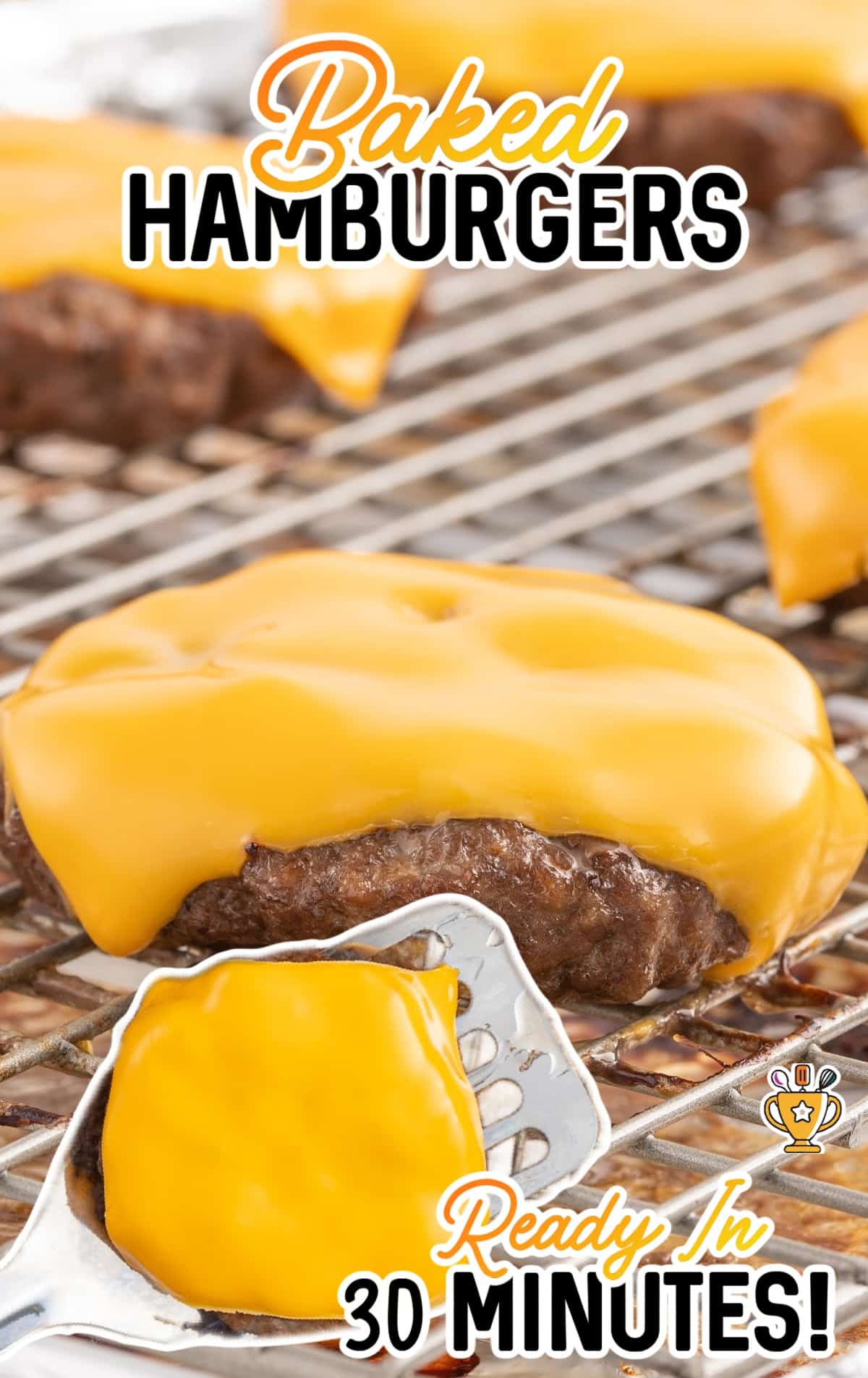 close up shot of Hamburgers topped with a slice of American cheese on a baking rack