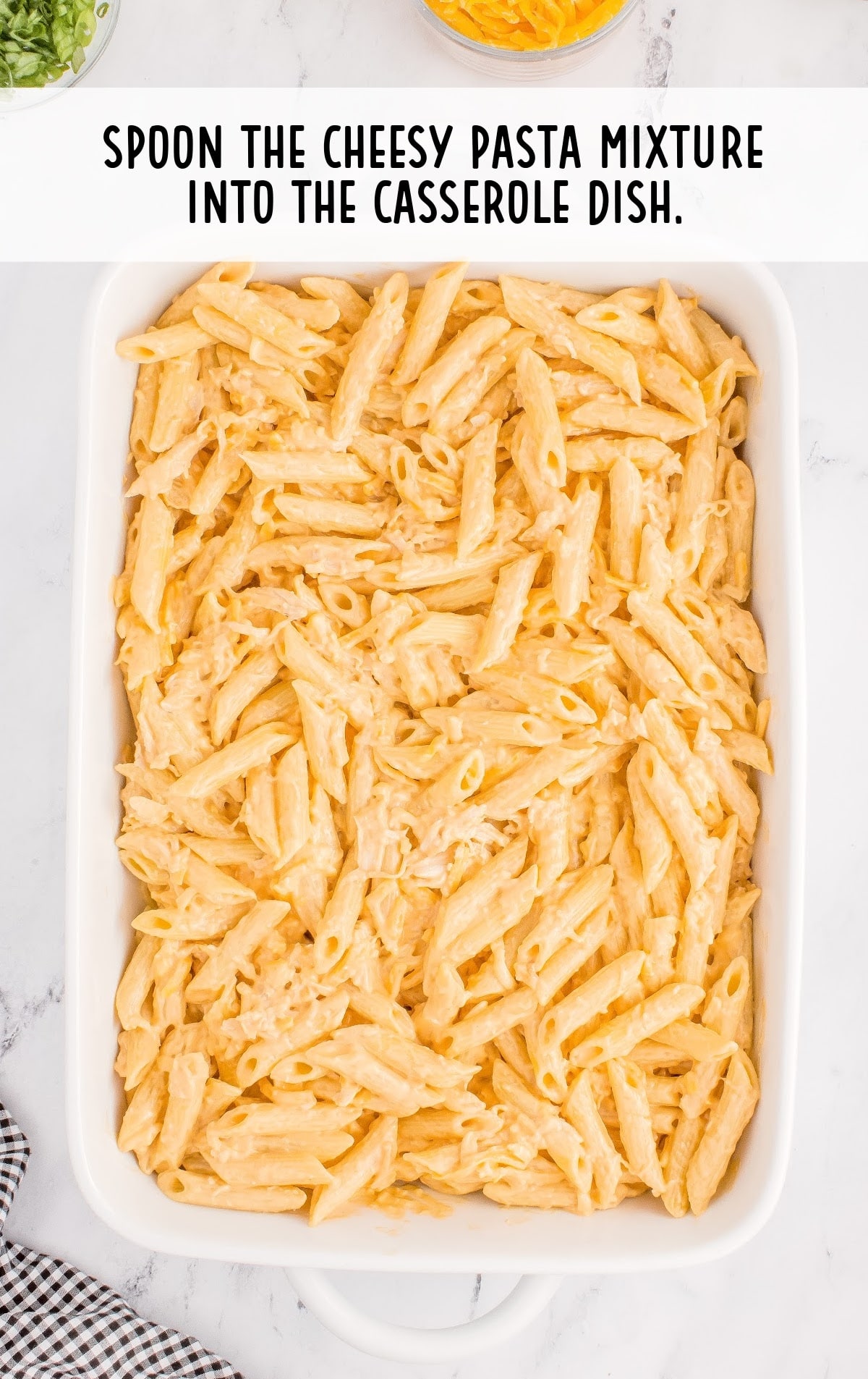 cheesy pasta mixture placed into a casserole dish