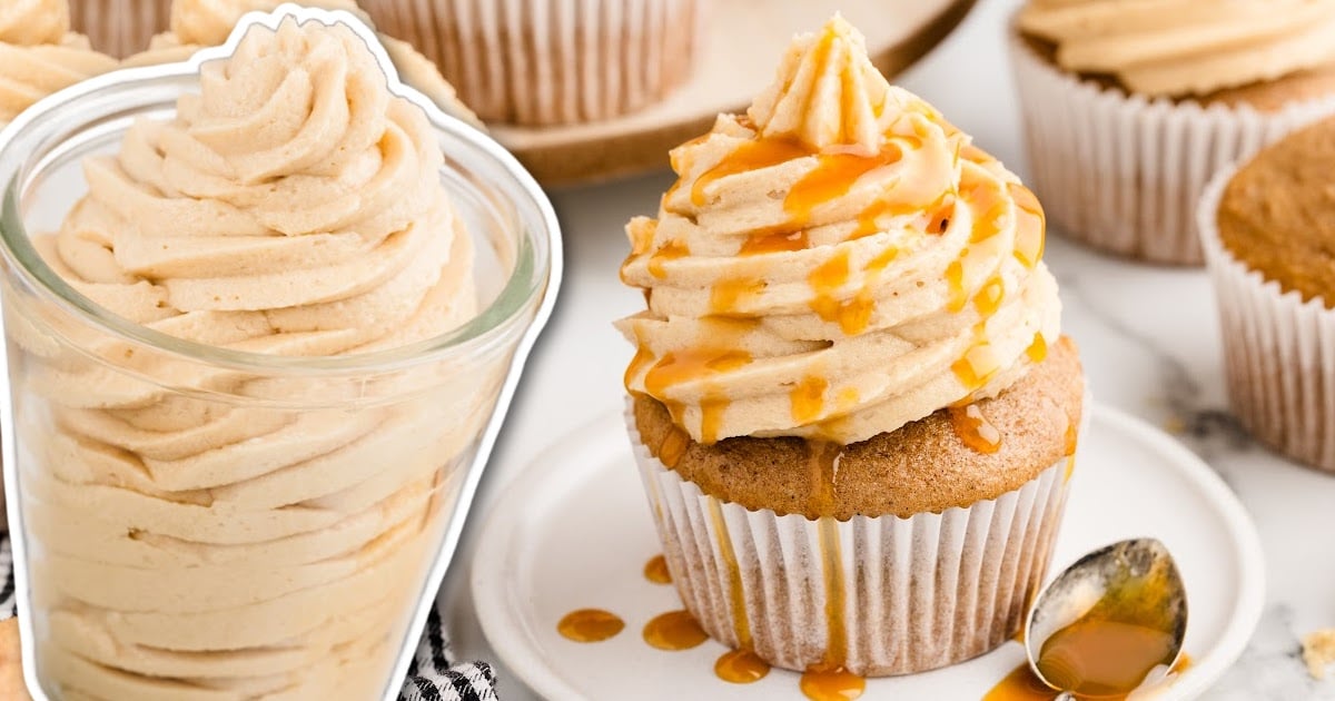 A close up shot of a cupcake topped with caramel icing