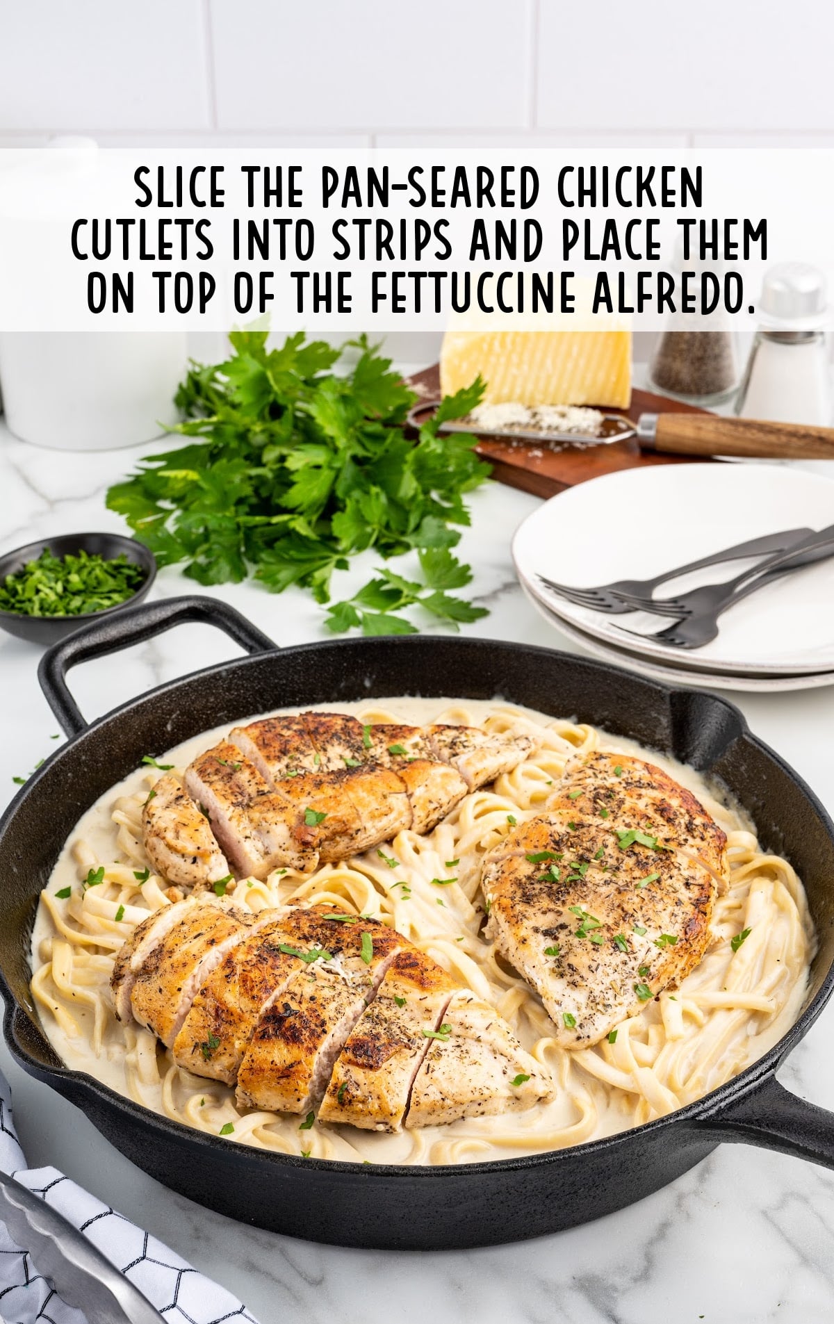 chicken sliced and placed on top of the pasta