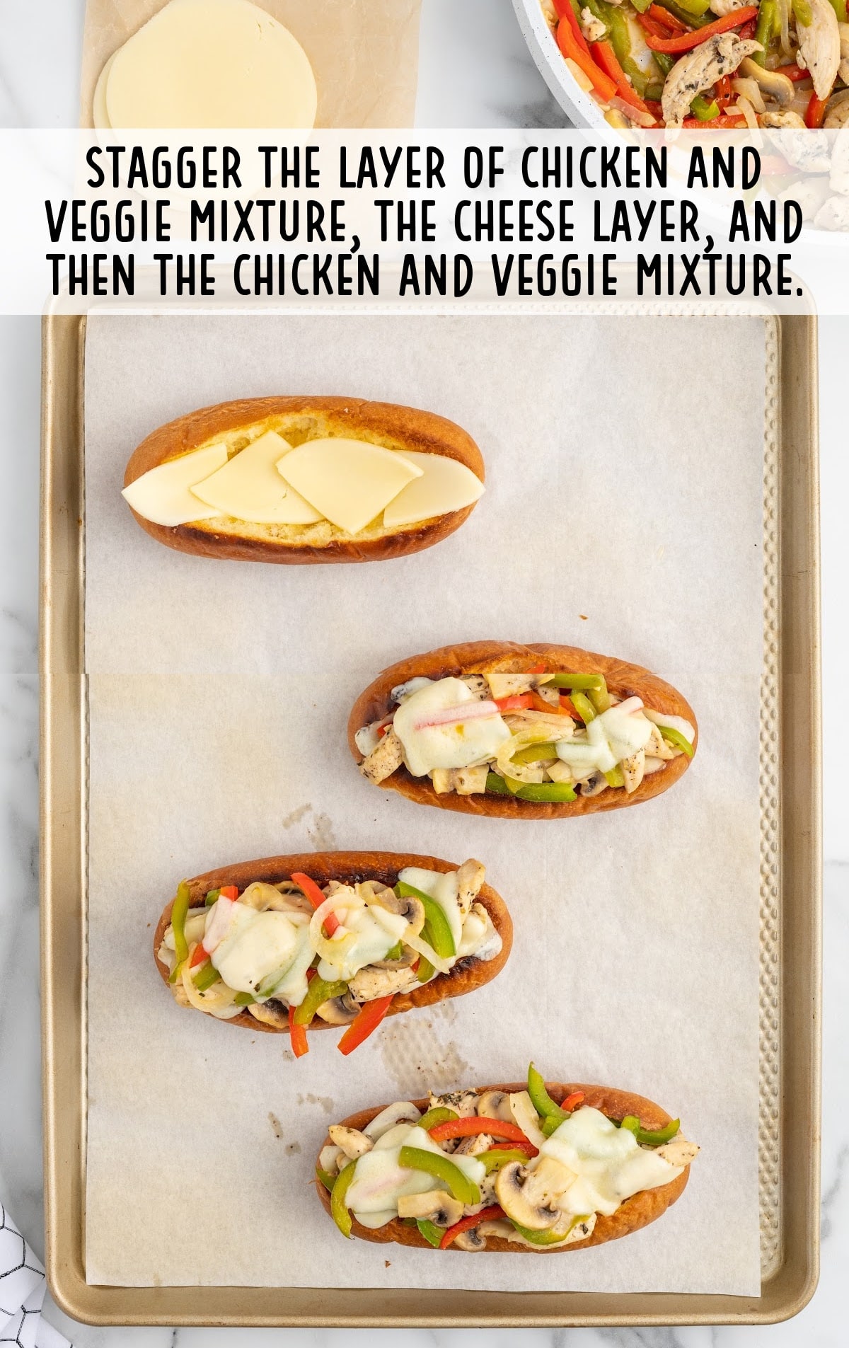chicken and veggie mixture on a baking sheet