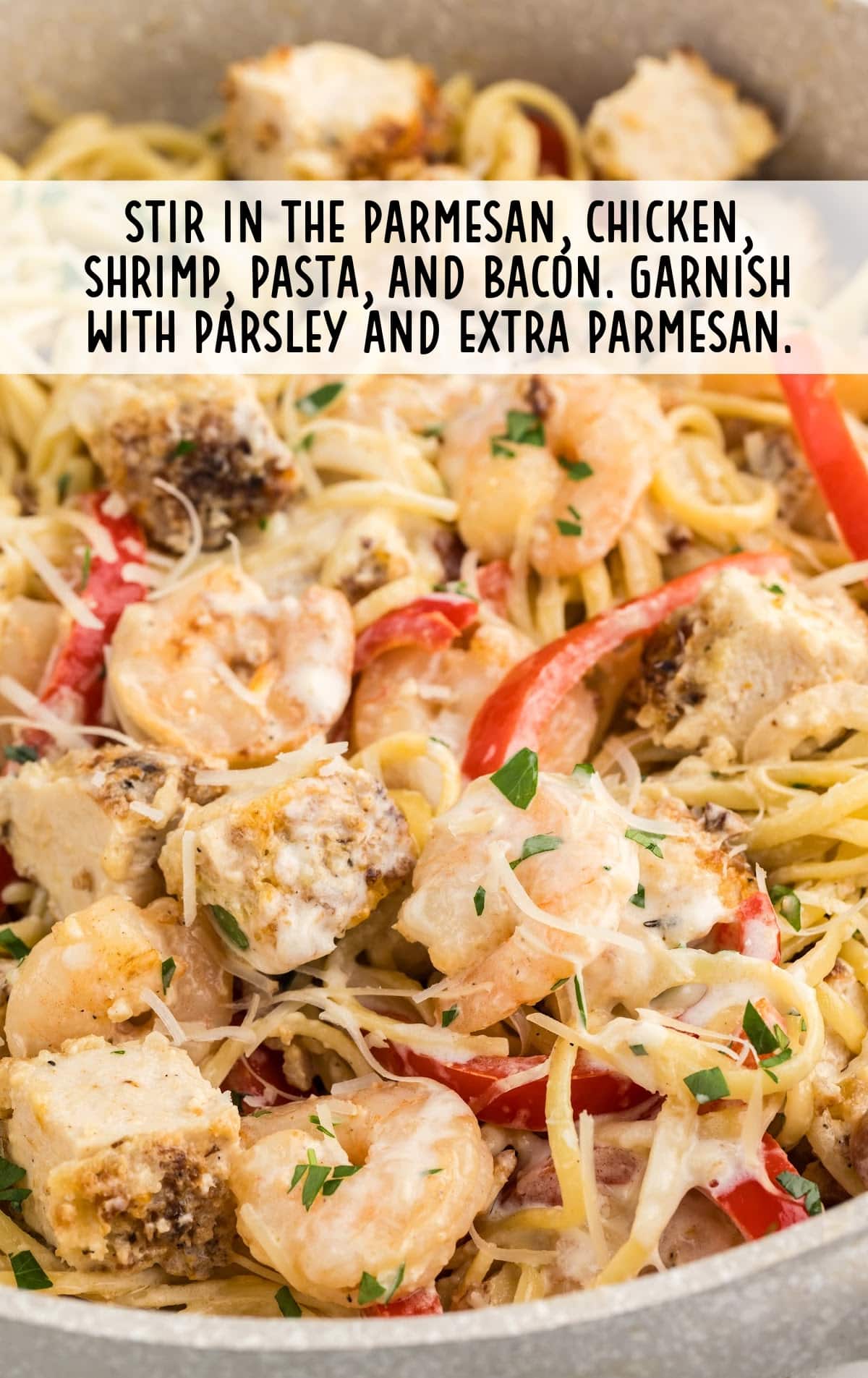 parmesan, chicken, shrimp, pasta, and bacon stirred together